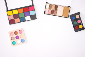 Colorful Eye shadow palettes on the white background 
