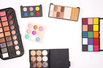 Colorful Eye shadow palettes on the white background 