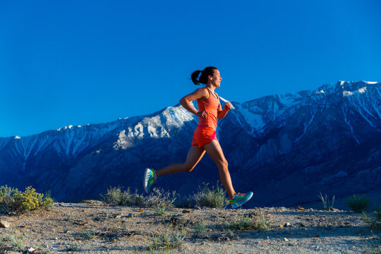A woman goes for a run in the Alabama Hills near Lone Pine, California in spring.