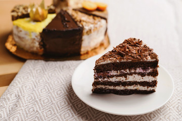 Assortment of pieces of cake on messy table, copy space. Several slices of delicious desserts, restaurant menu concept, top view