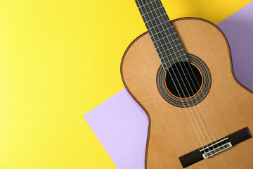 Beautiful classic guitar on two tone background, space for text