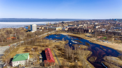 Aerial view of park and river in city in spring