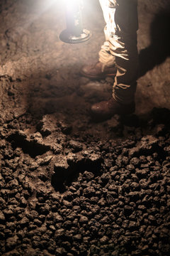 A detail shot of the rocky floor of the 13,042 foot long Ape Cave near Mount St. Helens in the Gifford Pinchot National Forest of western Washington State. The cave is the third longest known lava tube in North America. The cave is open year round and has a easier, shorter lower cave section and a slightly more physical and longer upper cave section.