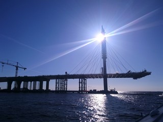 Construction of the bridge in St. Petersburg, a clear day, the view from the water.