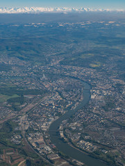 Rhine river, Basel city, Jura and Alps mountains on horizon in one frame from bird's view