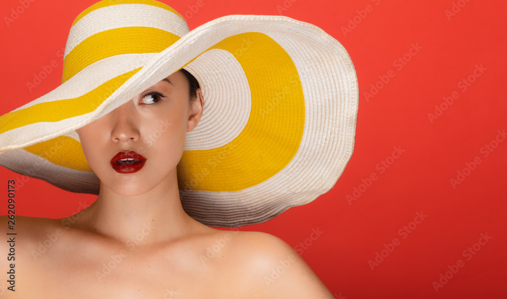 Wall mural attractive woman with summer hat