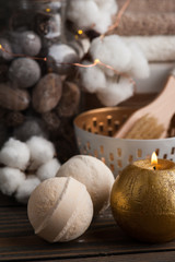 Obraz na płótnie Canvas Spa products with golden candle and cotton