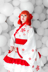 girl in kimano on the background of balls