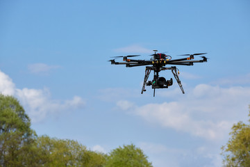 Octocopter flight over the forest. unmanned aerial vehicle. photographing from the air. - 262091554