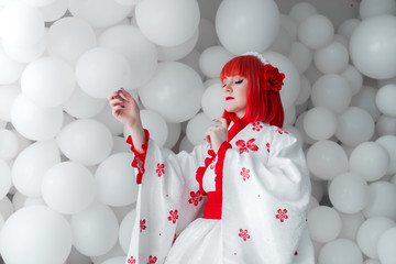 girl in kimano on the background of balls