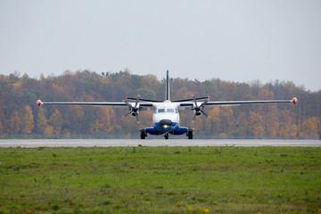 white big plane in front of the runway.  Autumn cold foggy day - 262091934