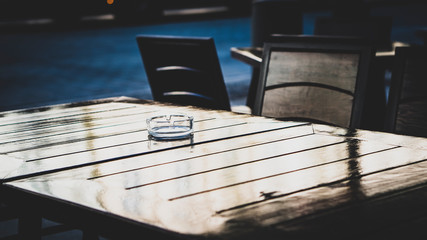  ashtray on a table in an outdoor cafe
