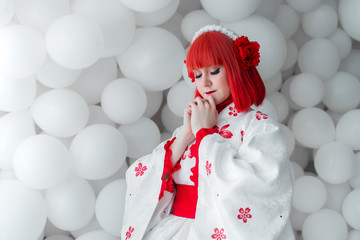 girl in kimano on the background of balls