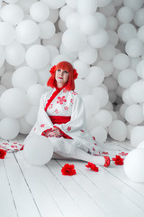 girl in kimano on the background of balls