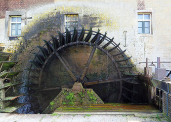 Waterwheel of a authentic watermill that uses hydropower.