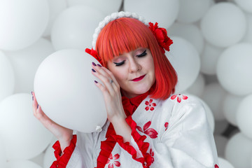 girl in kimano on the background of balls
