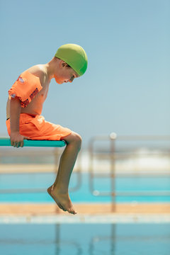 Boy Afraid Of Diving In The Pool