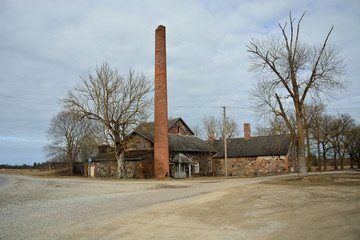 Fototapeta premium Old stone village smithy with a pipe