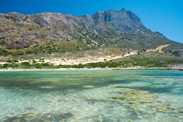 Gramvousa Castle and Balos Lagoon. Beautiful beach with clear blue water. View of the island from the water. Mountain in the background. Crete - 262094149