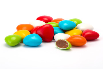 dragees with chocolate filing on white background