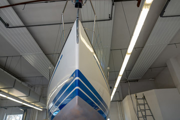 Fototapeta premium a sailing ship stands in a paint shop to be repainted