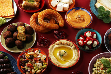 Middle eastern or arabic dishes and assorted meze, concrete rustic background. Falafel. Turkish Dessert Baklava with pistachio. Halal food. Lebanese cuisine