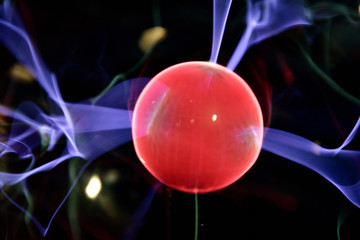 Lightning meeting electrode in the plasma lamp, glowing red