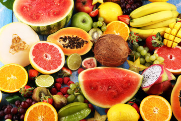 Tropical fruits background, many colorful ripe fresh tropical fruits