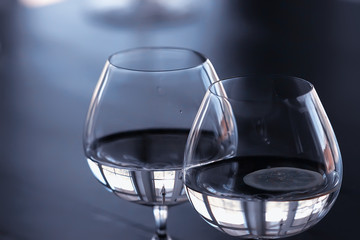 glass of white wine in the restaurant / white wine in the interior of the restaurant a table with glasses of wine, a romantic summer