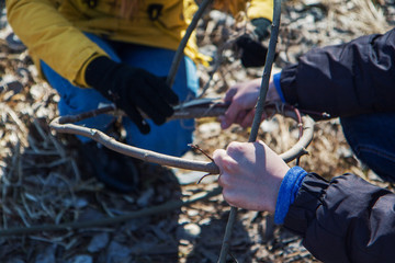  tourists  are tinkering from branches