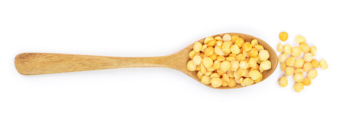 yellow split peas in a wooden spoon isolated on white background. Top view