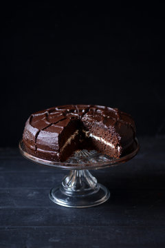 Dark chocolate devil's food cake with slice missing