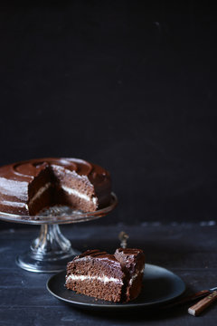 Slice taken out of dark chocolate devil's food cake