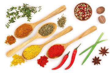 mix of spices in wooden spoon isolated on a white background. Top view. Flat lay. Set or collection