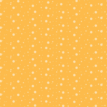 Seamless background with small circles on an orange background.