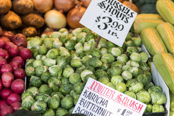 Brussels sprouts and other vegetables at a stall at Pike Place Market in Seattle.