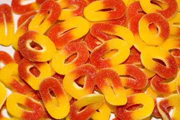 Candies made of jelly and sugar. Layout of colourful array of child sweets and treats. 