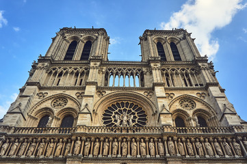 Fototapeta na wymiar Gothic facade of the cathedral of Notre-Dame de Paris, France.