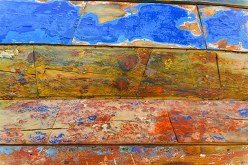 Fototapeta na wymiar Painted wooden boards of various colors aged, natural texture background.