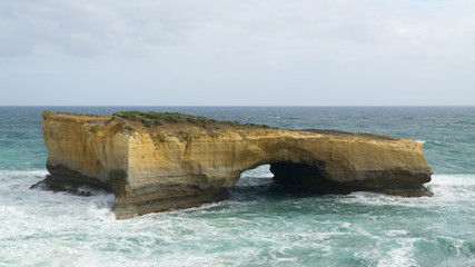 Fototapeta na wymiar Famous London Arch - natural stone arch, one of many rock formations along The Great Ocean Road, Australia