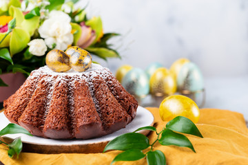 Chocolate Easter cake and Easter eggs. Selective focus.