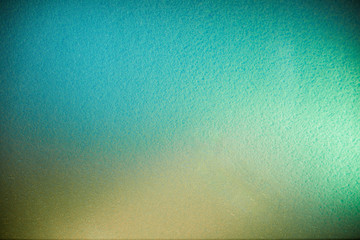 Green and turquoise background in combination with yellow in full blur