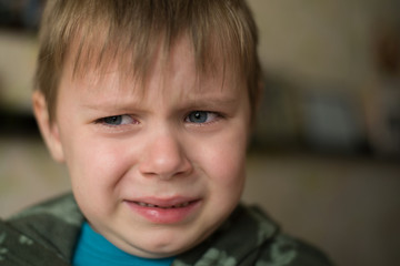 Little boy crying close up. Children's grief, sadness concept.