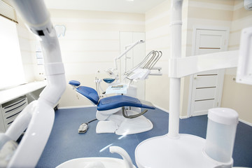 Wide angle background image of dental chair and equipment in empty dentists office, copy space