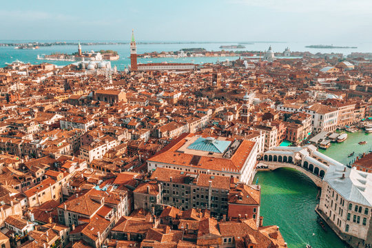 Epic Panoramic Aerial Cityscape Of Venice With Santa Maria Della Salute Church And Rialto Bridge In Veneto, Italy 