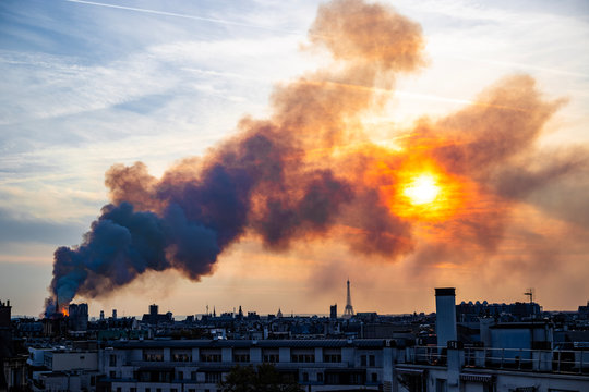 Notre Dame burning during sunset, Paris