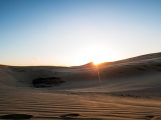 Fototapeta na wymiar Sunset behind Giant Sand Dunes near Cape Rienga, New Zealand