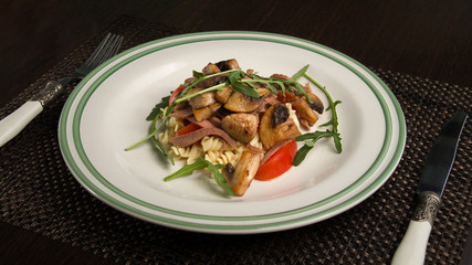 Tuna meat and pasta salad with vegetables and tomato sauce