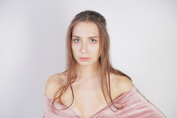 Obraz premium cute young caucasian girl is sad on white background in Studio