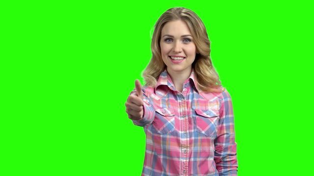 Happy beautiful woman showing thumb up. Young attractive woman in casual outfit giving tumb up symbol on Chroma Key background.